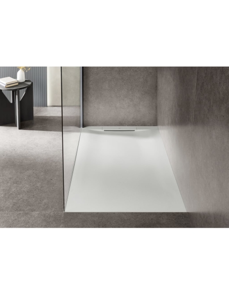 Plato de ducha extraplano de STONEX®.Superficie antideslizante con textura de arena. Incluye desagüe de gran caudal y sifón extr